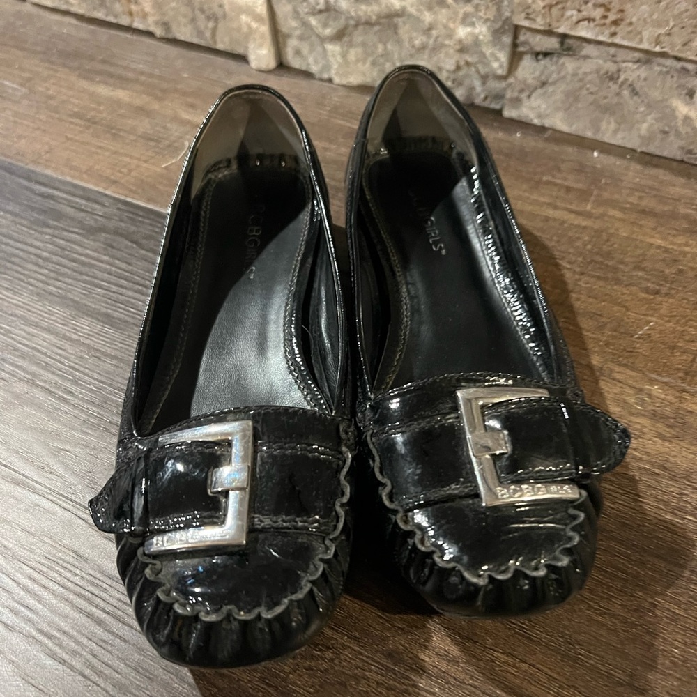 BCBGirls black loafer with silver buckle